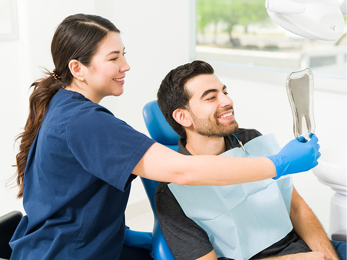 family-and-contractor-reviewing-blueprints